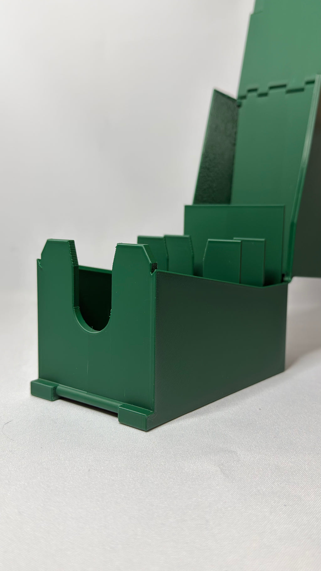 A dark green plastic organizer tray for MTG commander deck with a hinged lid, shown open on a light gray background.