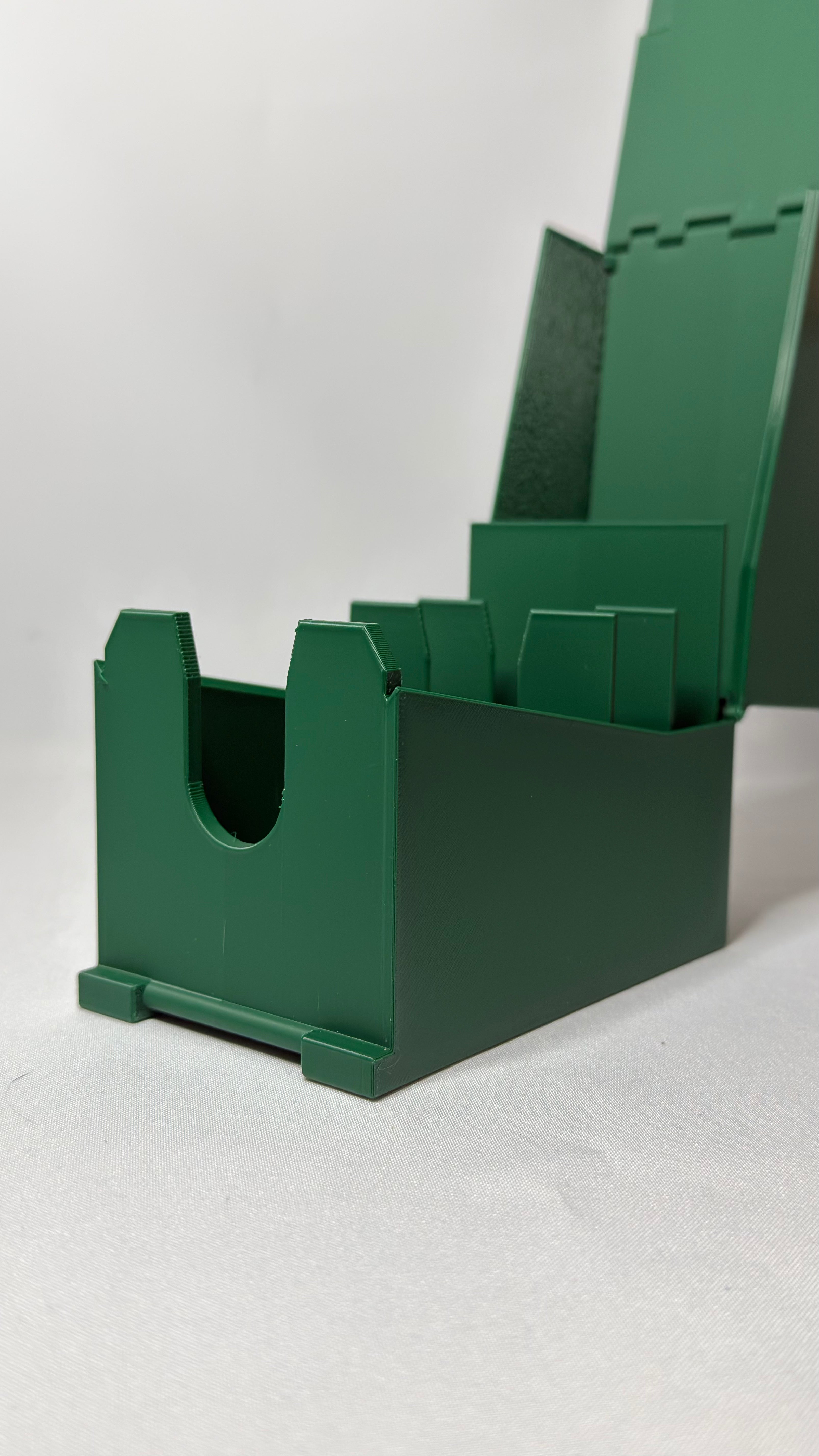 A dark green plastic organizer tray for MTG commander deck with a hinged lid, shown open on a light gray background.
